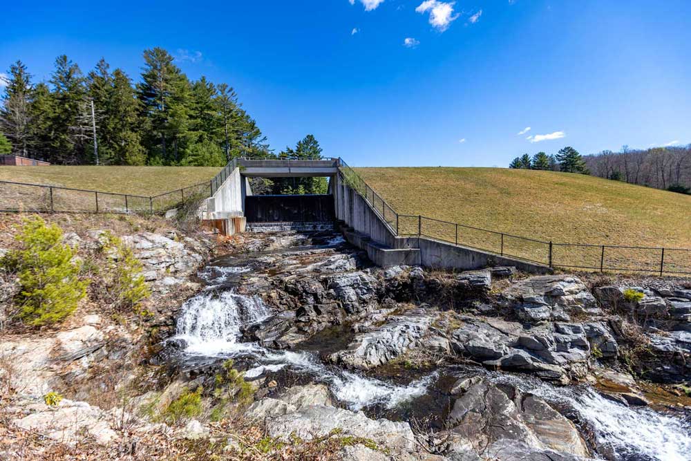 Water cascades down the dam at Killingworth reservoir